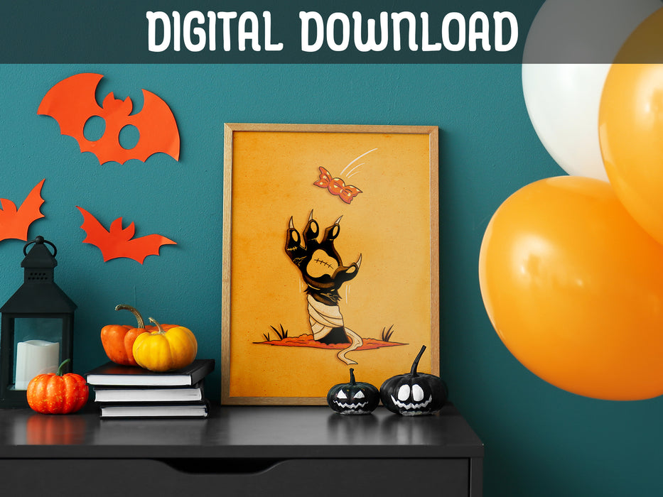 DIGITAL DOWNLOAD: halloween zombie cat paw art print in wooden frame leaning against teal wall sitting on black dresser counter surrounded by halloween decor such as orange and white balloons, bats, pumpkins, jack-o-lanterns, and candles