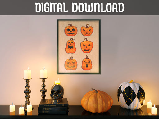 DIGITAL DOWNLOAD: halloween art print in frame hung on white wall depicting two rows of pumpkins with different faces, hung over counter surrounded by halloween decor such as pumpkins, candles, and a black skull