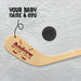 Close-up of the blade showing baby name “Andrew” in bold lettering with birth date and weight arranged below, surrounded by small hockey stick graphics for a classic hockey-themed design.