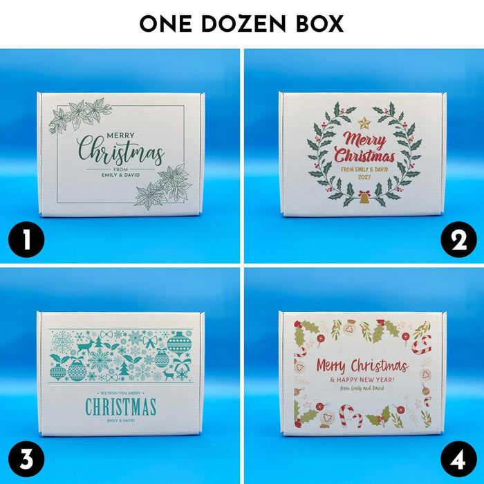 One dozen Christmas golf ball gift boxes shown in four printed designs, including botanical, wreath, blue sweater-style, and festive holiday illustration designs.
