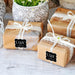 Wrapped wedding gifts tied with ribbon and decorated using personalized “With Love” foil cardstock tags. Styled for weddings, bridal showers, and elegant celebration gifting.