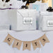 Wedding gift bags displayed with personalized “Happily Ever After Starts Now” gift tags attached to the front. The elegant tags add a decorative touch to wedding welcome bags and party favors.