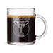 A glass mug filled with a dark liquid, likely coffee or tea, with a trophy-like design engraved on it, that reads "Kayleigh Mom #1 2026".