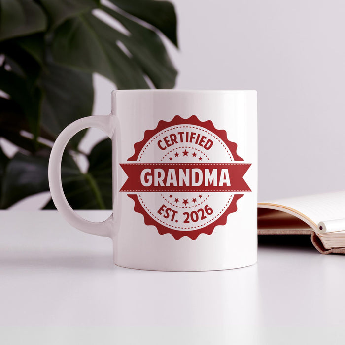 Personalized Grandma ceramic mug displayed on a table with custom EST year.
