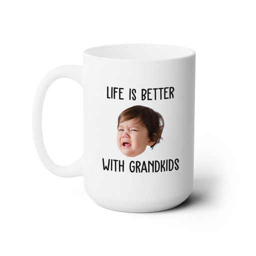 A white ceramic mug with a printed message that reads "LIFE IS BETTER WITH GRANDKIDS".