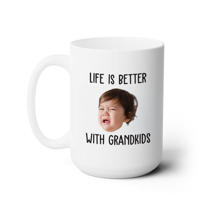 A white ceramic mug with a printed message that reads "LIFE IS BETTER WITH GRANDKIDS".