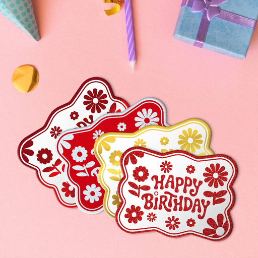 Four Happy Birthday rectangle tags in metallic red, metallic gold, glitter white, and glitter red.