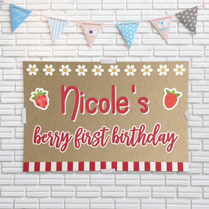 Strawberry themed birthday banner displayed against a white brick wall showing the printed butcher paper material and colorful custom design.