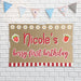 Strawberry themed birthday banner displayed against a white brick wall showing the printed butcher paper material and colorful custom design.