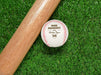 A baseball and wooden baseball bat sits on a green grassy background. The baseball has a year, player's name, number, and school name engraved into it. This design features a home plate graphic below the other text.