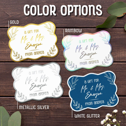 The “Mr. & Mrs.” wedding gift tag design shown in Gold, Rainbow, Metallic Silver, and White Glitter foil finishes. Personalized foil cardstock tags include custom names and decorative botanical accents.