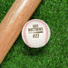 An engraved baseball and wooden baseball bat sits on a green grassy background. The engraved design features the player's name and jersey number along with a baseball bat graphic.