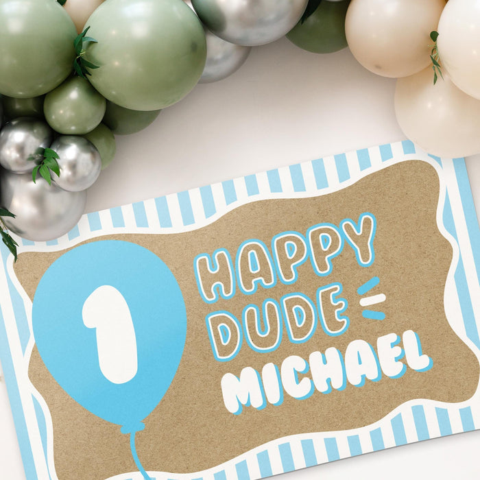 Angled view of the personalized birthday banner highlighting the striped border, blue balloon design, and custom name personalization.