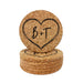 Stack of round cork coasters featuring a large hand-drawn heart design with personalized initials on a white background.