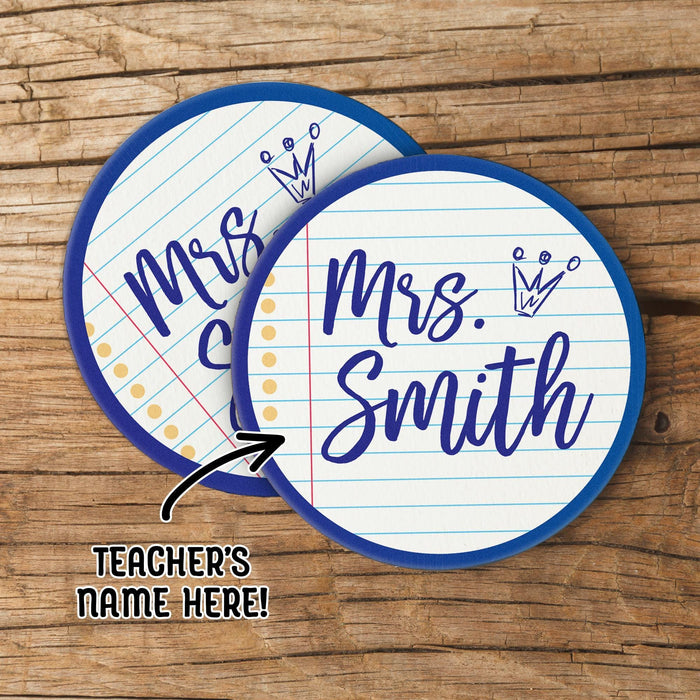 Personalized teacher coasters with custom name shown on a wood background. Demonstrates personalization and design placement.