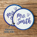 Personalized teacher coasters with custom name shown on a wood background. Demonstrates personalization and design placement.