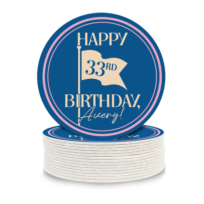 A stack of blue and white birthday plates with a circular design that reads "HAPPY 33rd BIRTHDAY, Avery!"
