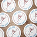 Multiple round martini coasters arranged together, each featuring the personalized bar name, martini glass design, and established year.