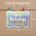 Rounded rectangle Christmas gift tag size guide showing dimensions on kraft paper with colorful mini clothespins.