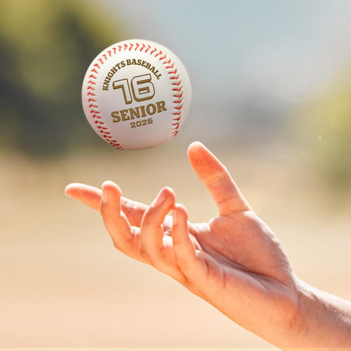 A personalized baseball is being thrown into the air by a person's hand. It is featuring a school/team name (Knights Baseball), a number #16, a word SENIOR & a year 2026