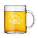 A glass mug with a handprint design and text engraved on it.