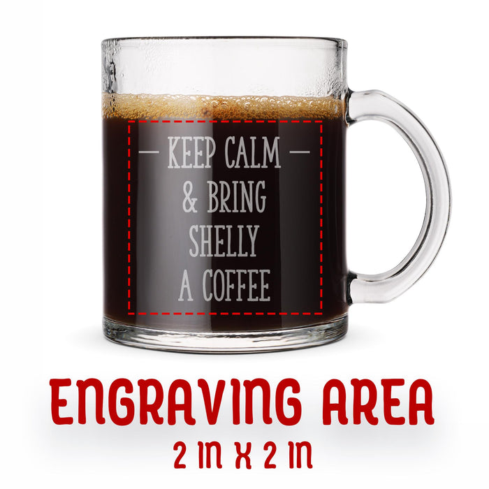 A glass mug with an engraved design on it. The mug is filled with tea, and there is text under the mug that reads "Engraving Area is 2 in x 2 in”