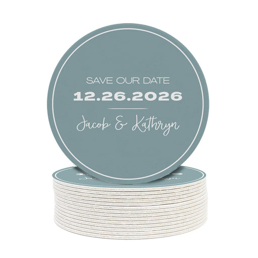 Save the Date wedding coaster featuring a minimalist design with custom names and wedding date. Printed on heavyweight absorbent paper coaster material.