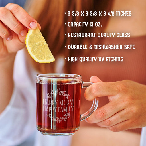 A person is holding a glass mug with a message engraved on it. The image is accompanied by a text overlay that reads • 3 3/8 x 3 3/8 x 3 4/8 inches • Capacity 13 oz. • restaurant quality glass • durable & dishwasher safe • high quality uv etching