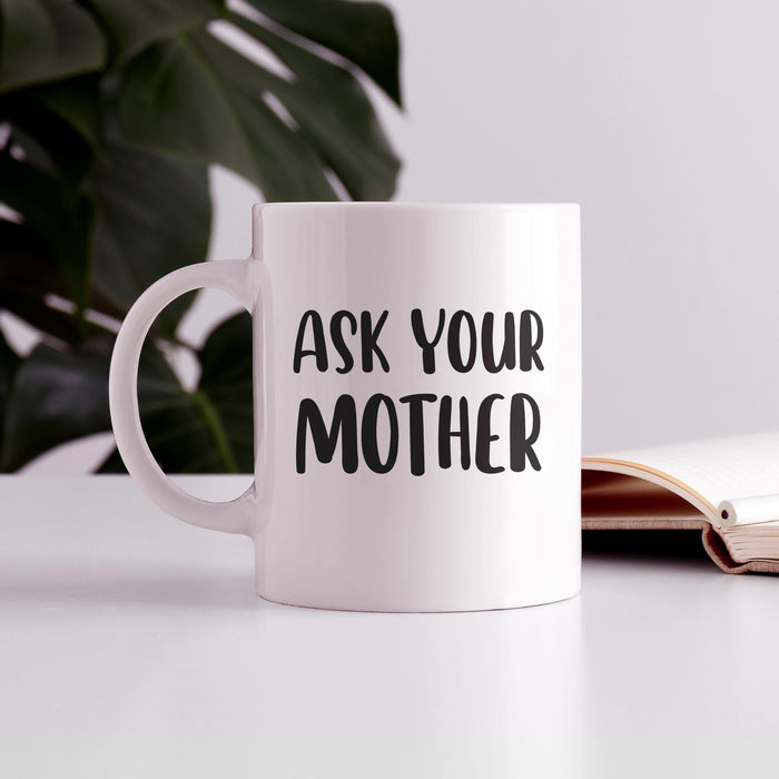 White ceramic mug styled on a desk beside an open book and plant. A clean home office scene showing the mug as a perfect daily coffee companion.