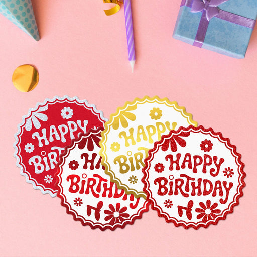 Four Birthday round tags in metallic red, metallic gold, glitter white, and glitter red.