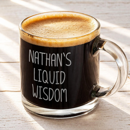 A mug of dark coffee with foam on top, sitting on a wooden surface.