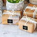 Wrapped wedding gifts tied with ribbon and decorated using personalized “Your Biggest Fans” foil wedding gift tags. Styled for weddings, bridal showers, and engagement celebrations.