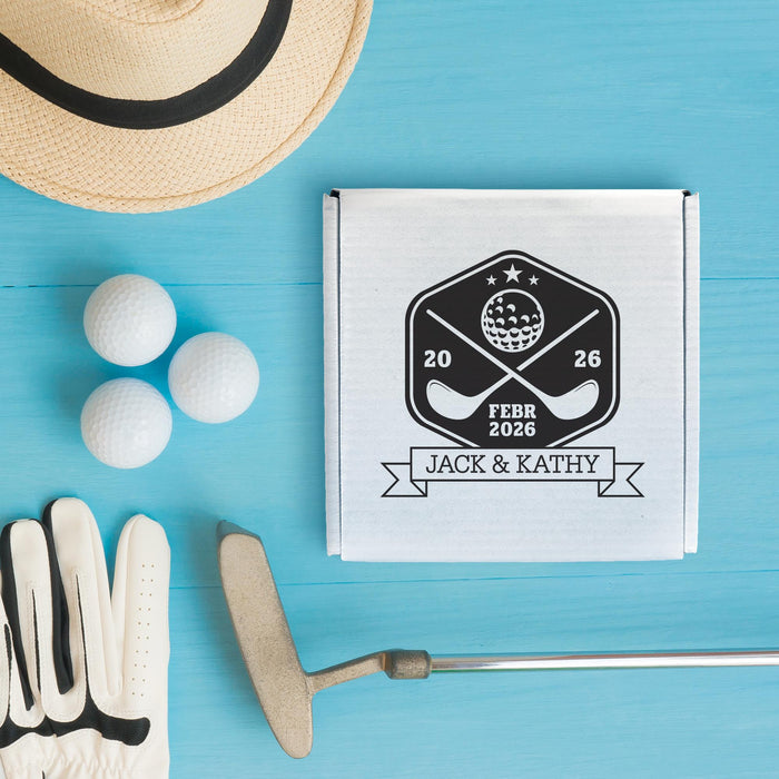 Golf-inspired wedding gift box personalized with couple names and wedding date. Displayed with golf balls and a golf tee.
