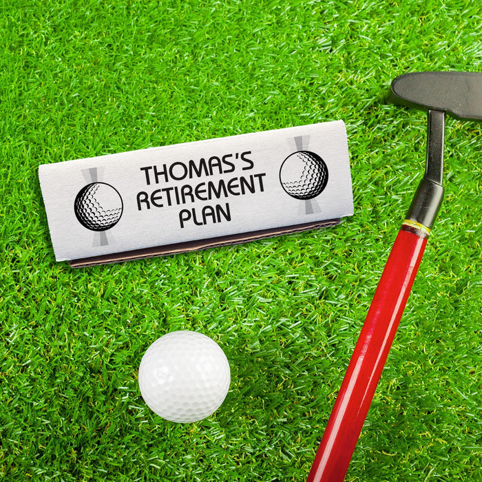 Golf-themed retirement gift box displayed with a golf club and golf ball. Personalized with a custom retirement message for golfers.