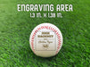 Text reads: Engraving area measures 1.3 inches x 1.38 inches.

A baseball is shown on a green grassy background. The baseball has a year, player's name, number, and school name engraved into it. This design features a home plate graphic below the other text.