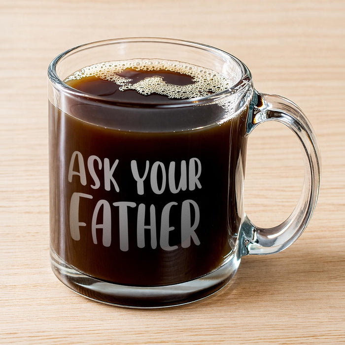 Clear glass mug filled with dark coffee featuring the engraved phrase “Ask Your Father” in bold frosted lettering. A simple product image highlighting the clean design and everyday coffee use.