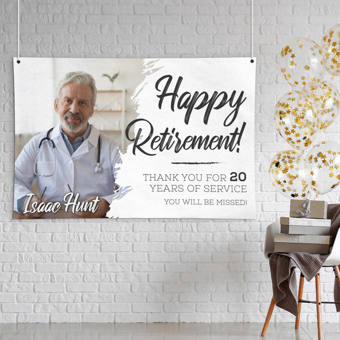 Personalized retirement banner displayed in a home or event setting. Features a custom photo, years of service recognition, and retirement message.