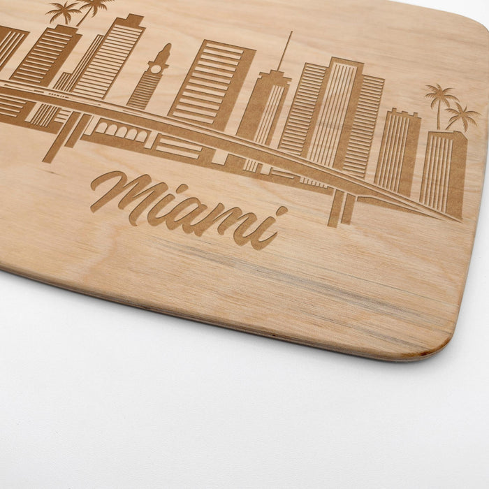 Close-up of the laser engraved Miami skyline with palm trees and Miami lettering on the maple cutting board.