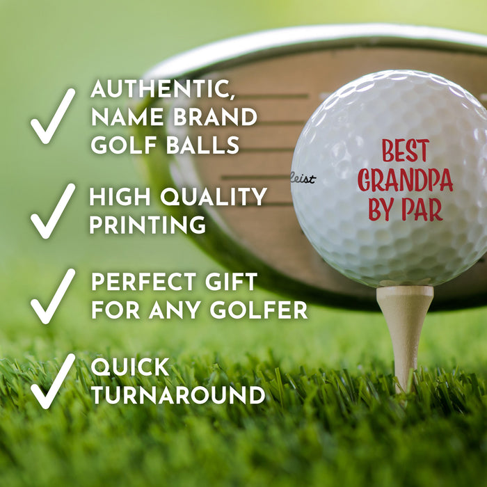 a golf ball with a personalized message on it, placed on a tee on a grassy golf course.
