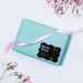 Small wrapped gift box decorated with a rainbow foil Bear Couple wedding gift tag tied with twine. Styled with soft pastel colors and floral accents for a wedding or bridal shower presentation.