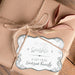 Personalized “Let Love Sparkle” wedding gift tag attached to kraft paper wrapping with natural twine. The metallic silver foil and decorative border create an elegant keepsake-style look.