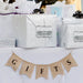 Silver wrapped gifts decorated with personalized “Mr. & Mrs.” foil wedding gift tags. Styled as elegant packaging ideas for weddings, bridal showers, and engagement celebrations.