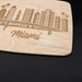 Close-up of the engraved Miami cityscape showing high-rise buildings, palm trees, and Miami lettering.