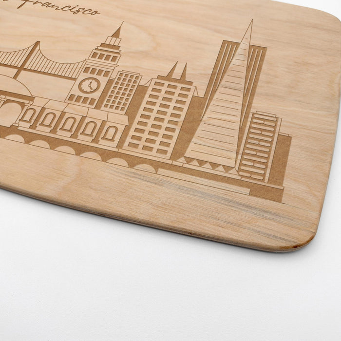 Close-up of the laser engraved San Francisco skyline design on a real maple cutting board.