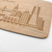 Close-up of the laser engraved San Francisco skyline design on a real maple cutting board.