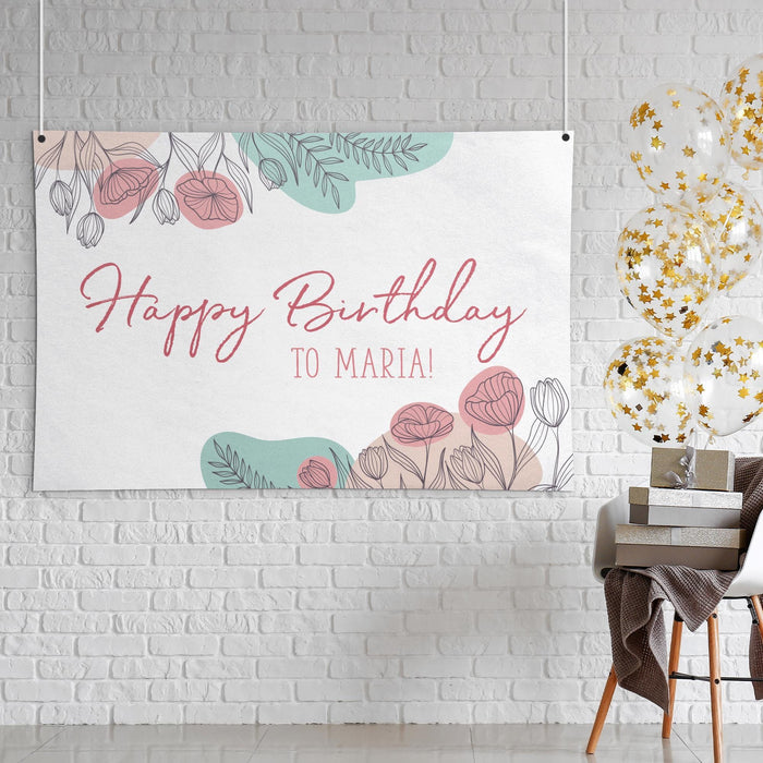 Personalized floral banner displayed as wall décor featuring a custom message and name.