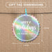 Round Christmas gift tag size guide showing dimensions on kraft paper with a colorful mini clothespin.