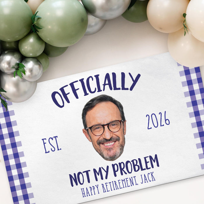 Close-up angled view of the Officially Not My Problem retirement banner showcasing the custom photo, retirement year, and personalized text details.