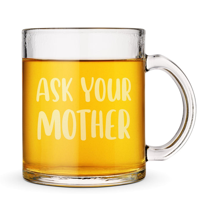 Front-facing product image of the engraved glass mug against a clean background with bright tea inside. A clear product-focused image highlighting the bold design.