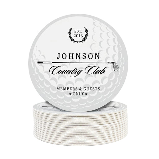 A stack of white coasters with black text and graphics on them, including text that reads "Est. 2013 Johnson Country Club MEMBERS & GUESTS ONLY" and a golf ball background.
